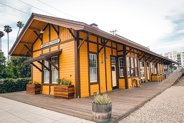 The historic Lankershim Depot, used by the Pacific Electric Railway and Southern Pacific Railroad, now adaptively reused as a Groundwork Coffee location.
