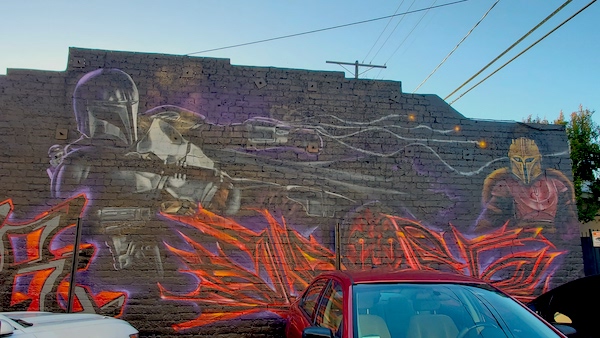 The Mandalorian and The Armorer from the Star Wars series, 'The Mandalorian' appear on this graffiti mural near Melrose and Fuller avenues.