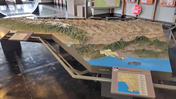 3D relief map of California showing the Los Angeles Aqueduct course from the Owens Valley to Los Angeles, on display at the Eastern Sierra Interagency Visitor's Center.