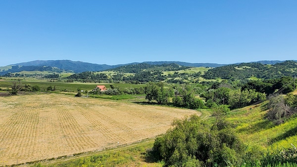 The green rolling hills of the Santa Ynez Valley, as seen from the grounds of Mission Santa Ines.